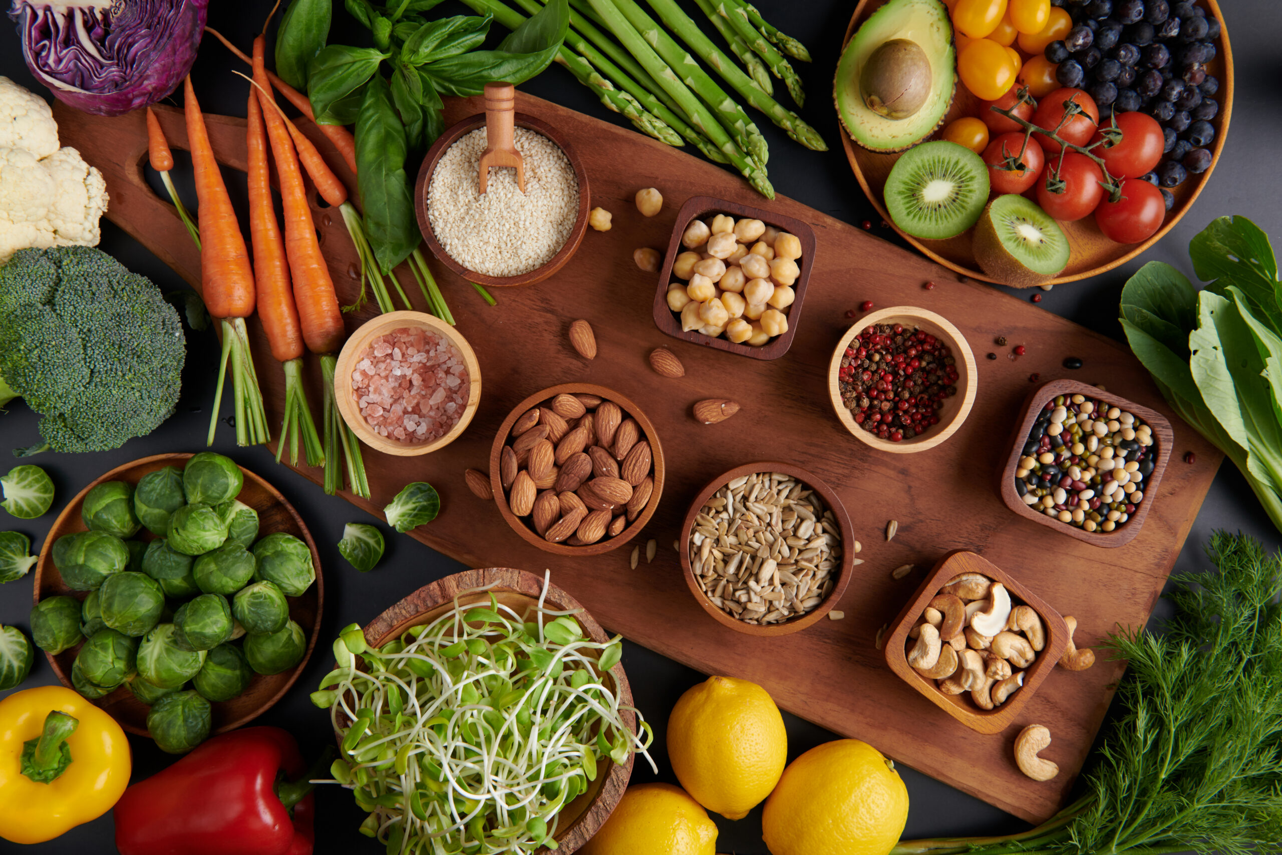Healthy plant-based foods including vegetables, fruits, nuts, and seeds. Avoiding meat to support the environment and sustainability.