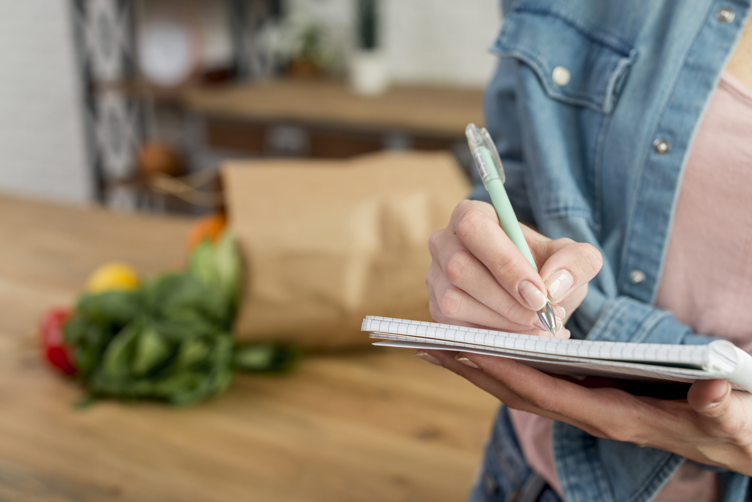 Women list groceries before shopping, which helps reduce food waste by preventing unnecessary purchases.