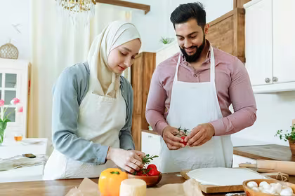 Man and woman preparing food for Ramadan