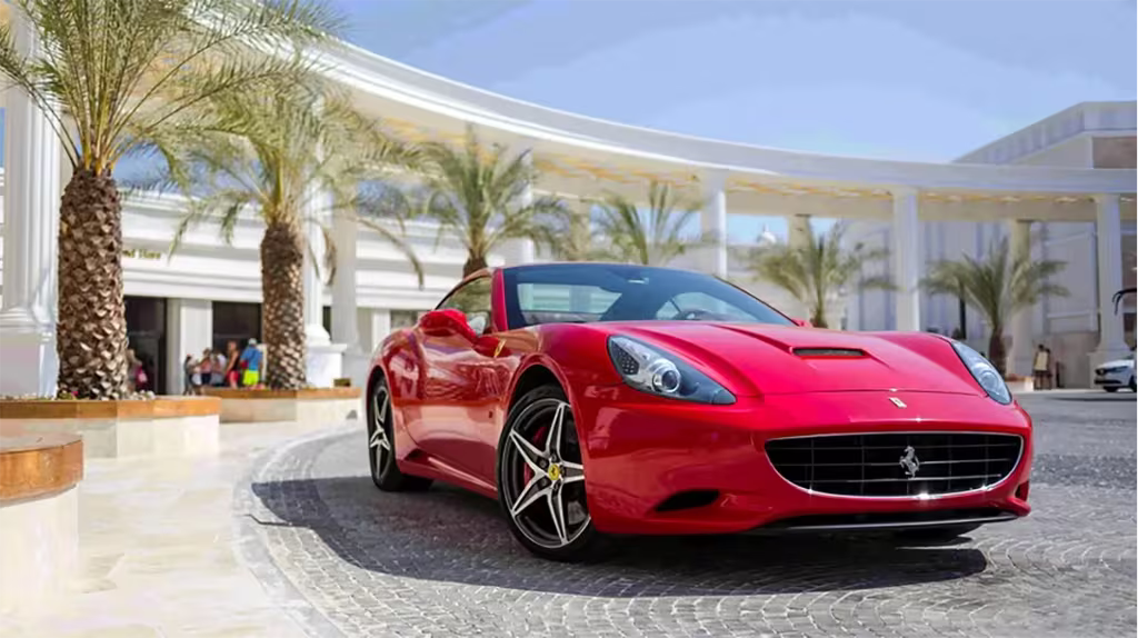 Best Things To Do In Dubai When You Have 24 Hours 13 Ferrari car outside hotel building with palm trees