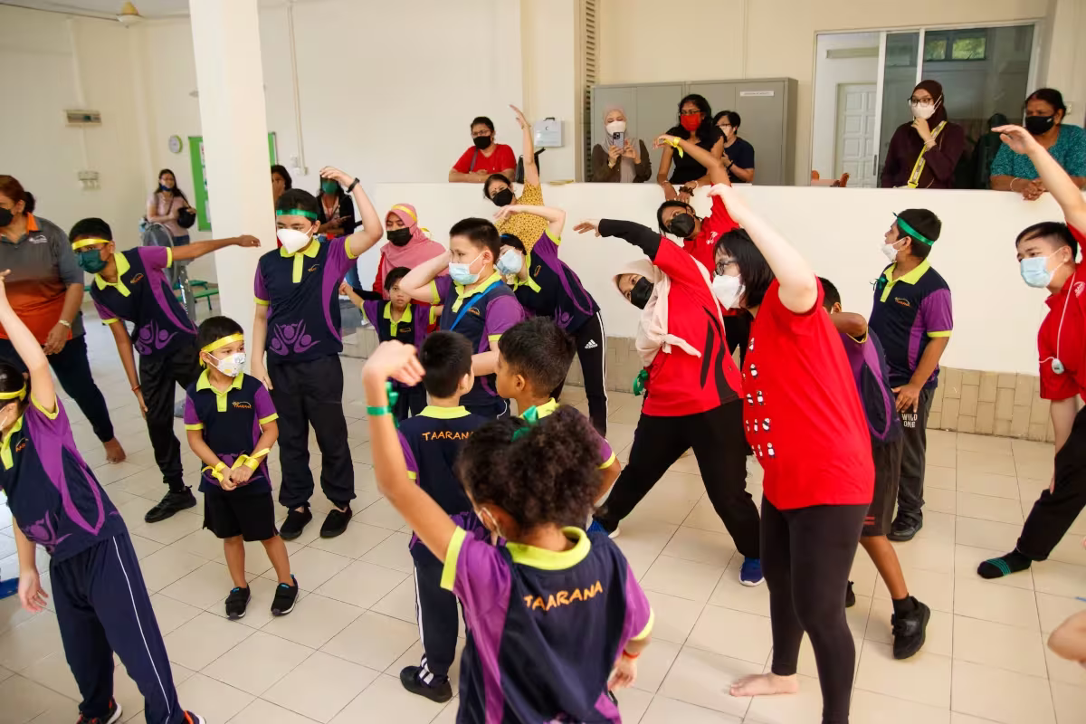Taarana staff going to a school to teach kids dancing 