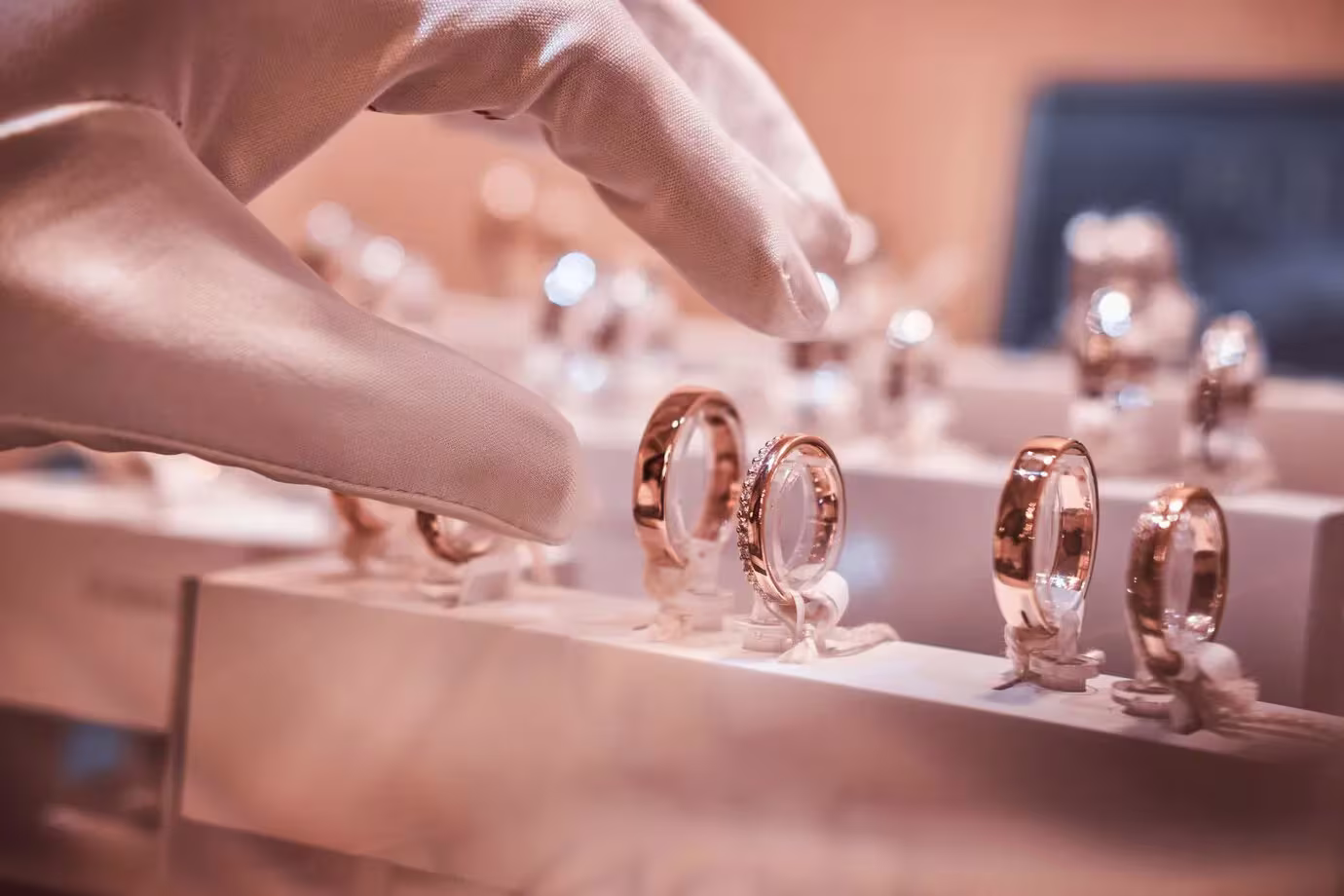 Unlock The Beauty Of Your 18K Gold Jewellery: Bernhard H. Mayer'S Expert Care Guide 2 18k gold jewellery showcased in a luxury store, displayed on hand gloves