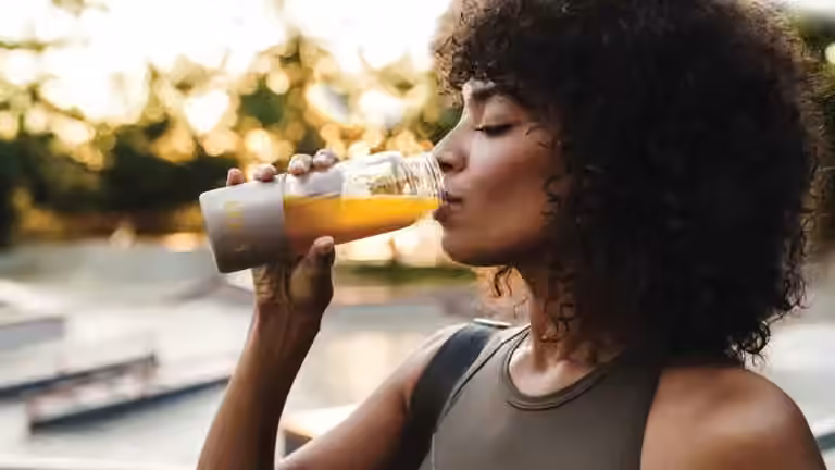 Woman drinking EDG3 Plus which provides the amino acids needed to produce glutathione for immunity