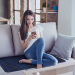 Girl using Amezcua GX-1 on the couch